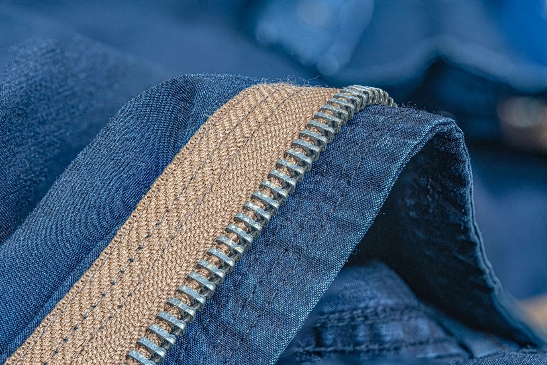 Blue fabric with a beige zipper detail